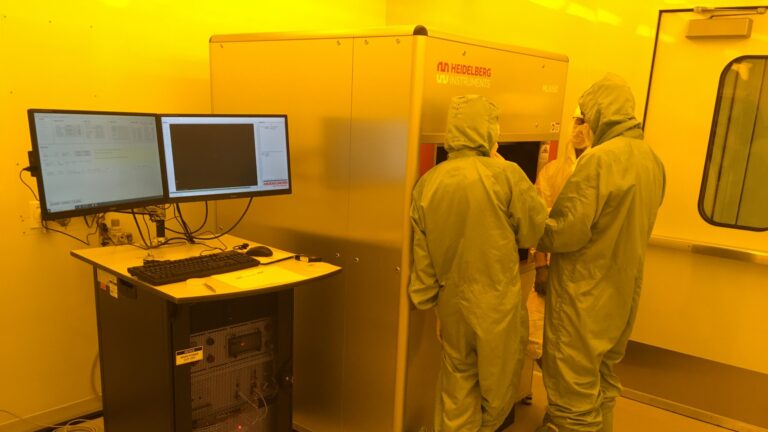 Technicians in the cleanroom at QMI.