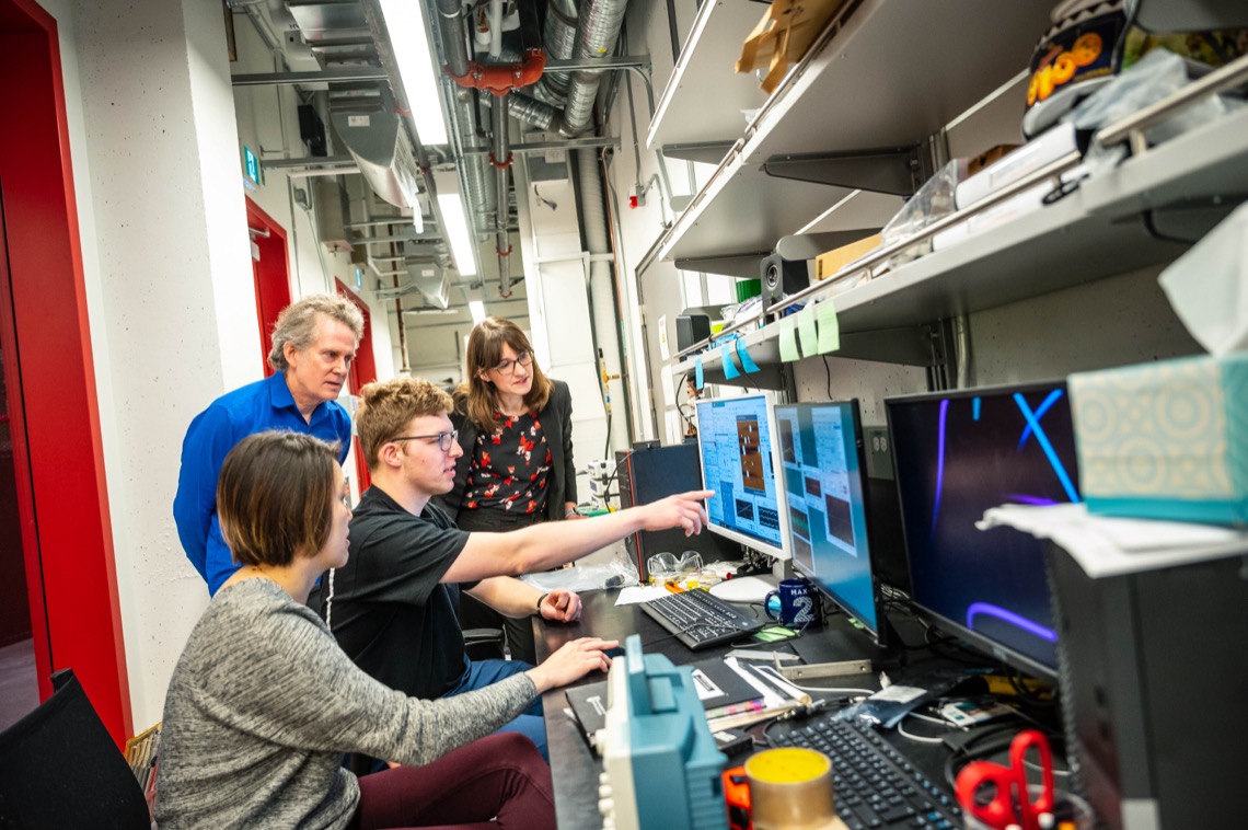 Researchers looking at imaging on a screen